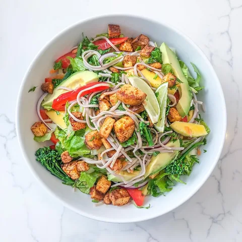 fitnessontoast Instagram post about Tofu mango soba noodle salad