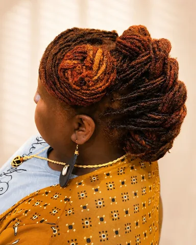 iamjafaea Instagram post about Colored loc updo